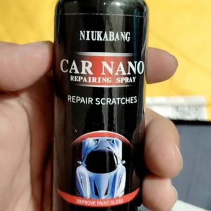 a hand holding car nano